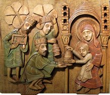 Trois rois mages se prosternent devant le Christ